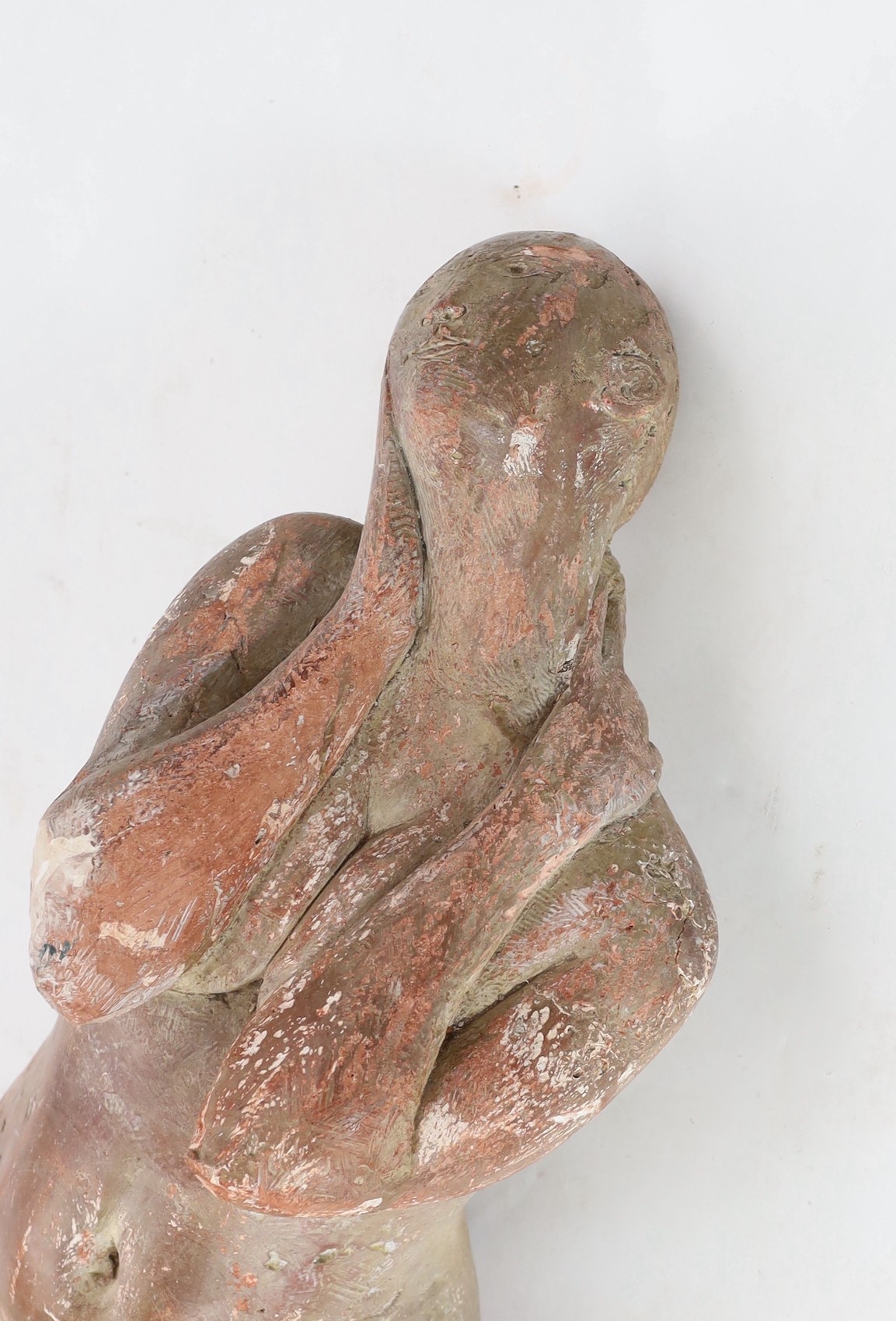 In the manner of Marino Marini, a terracotta sculpture, reclining female nude Length 120cm.